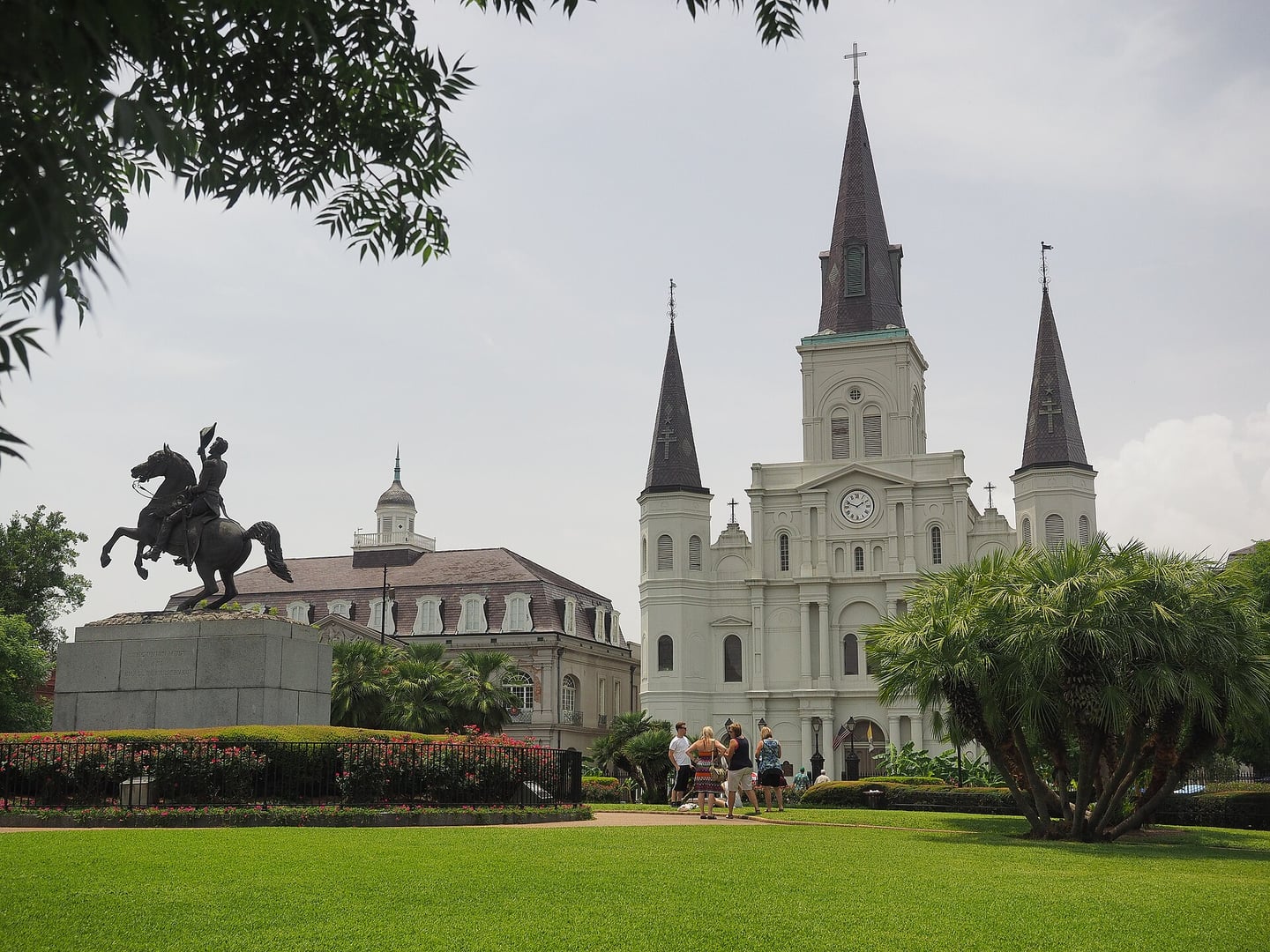 Three-spire facade of St. Louis Cathedral facing Jackson Square in the New Orleans French Quarter, America's oldest continuously active Catholic cathedral