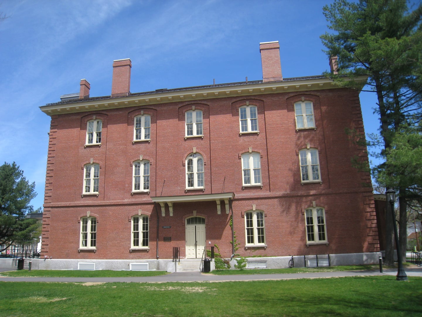 Adams Hall, a historic stone academic building on the Bowdoin College campus in Brunswick, Maine.