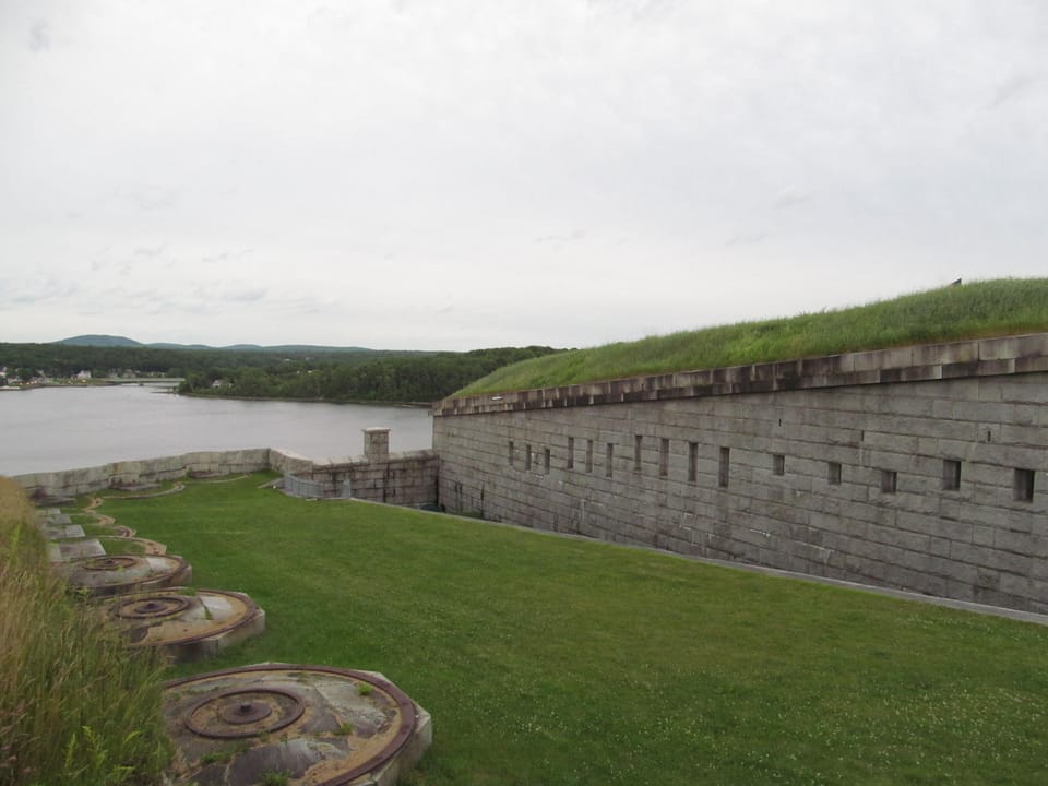 Grass-topped granite ramparts and cannon mounting rings overlooking the Penobscot River at Fort Knox, Prospect, Maine.