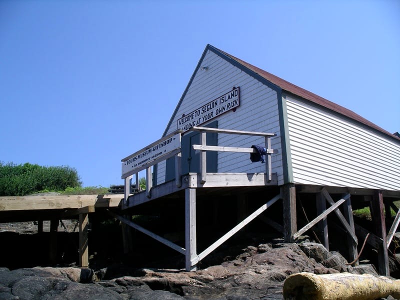 The keepers' boathouse at Seguin Island's harbor, signed 'Welcome to Seguin Island,' 2008.