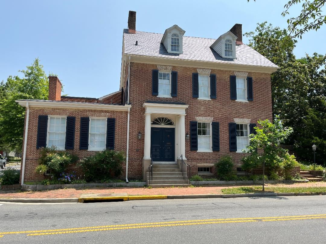 Federal-style brick facade of Foxley Hall on North Aurora Street in Easton, Maryland
