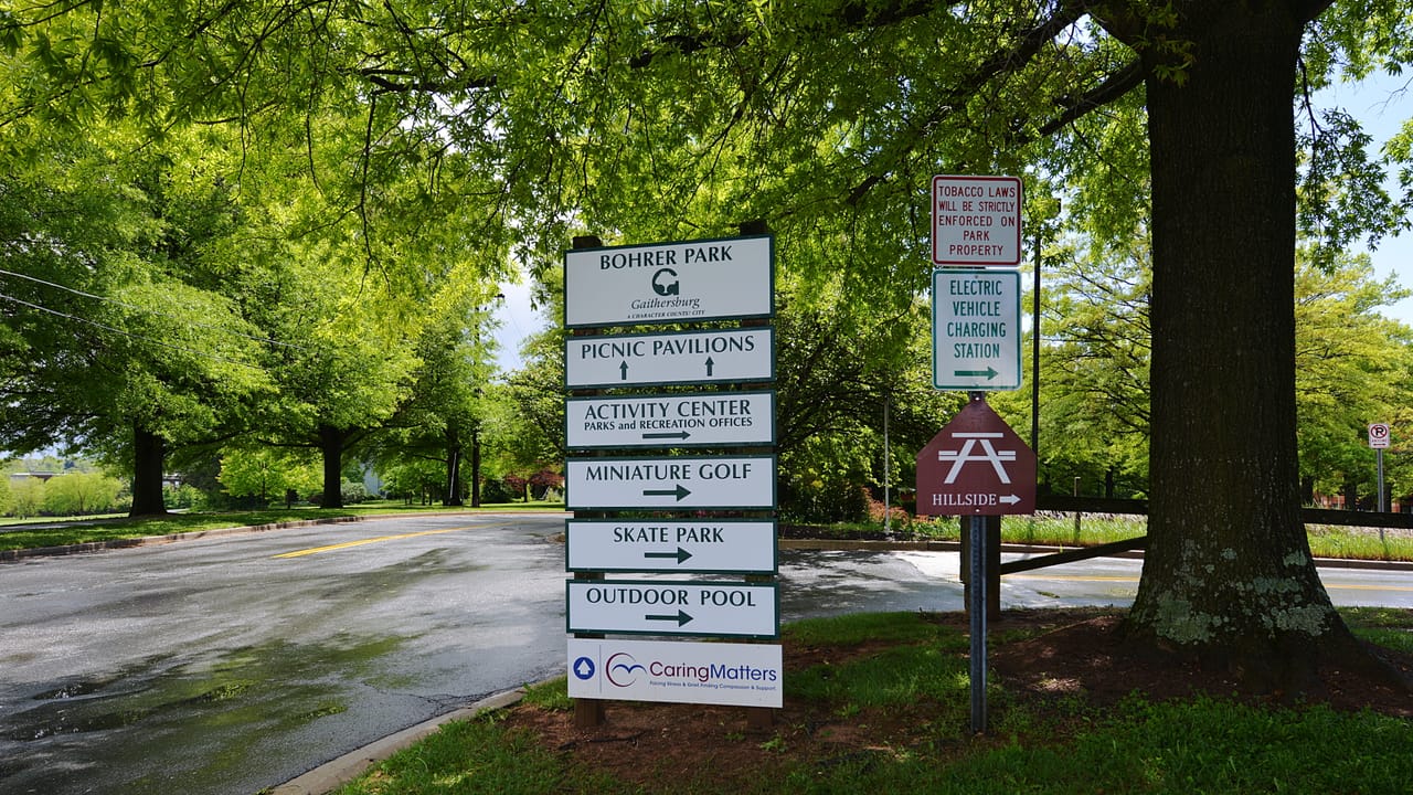 Signs at Bohrer Park showing where to go for different activities including Miniature Golf, the Skate Park, the Outdoor Pool, the activity Center, and Picnic Pavilions. This park is run by the city of Gaithersburg, Maryland. 506 South Frederick Avenue, Gaithersburg, Maryland 20877.