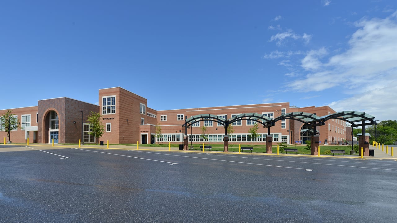 he Gymnasium side of Gaithersburg High School with the bus parking area, part of the Montgomery County Public School system. 101 Education Blvd, Gaithersburg, Maryland 20877.