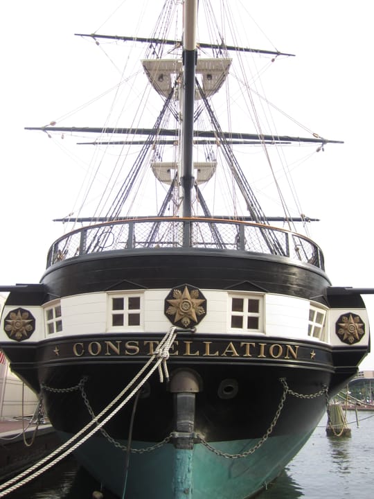 USS Constellation moored at Pier 1 in Baltimore's Inner Harbor, a tall-masted 1854 sloop-of-war
