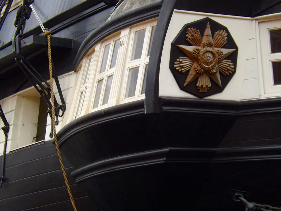 The carved transom ornament on USS Constellation's stern quarter gallery, Pier 1, Pratt Street, Baltimore.