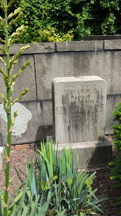 The weathered headstone of David Poe Sr., Edgar Allan Poe's Revolutionary War-veteran grandfather, in the burying ground