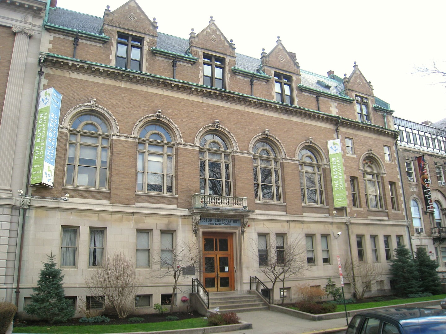 Exterior facade of Boston Conservatory at 8 Fenway in Boston, Massachusetts, featuring arched windows and wall dormers on the historic brick building