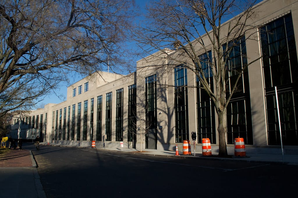 The brick exterior of the Cambridge Rindge and Latin School public high school in Cambridge, Massachusetts, with its iconic war memorial entrance.