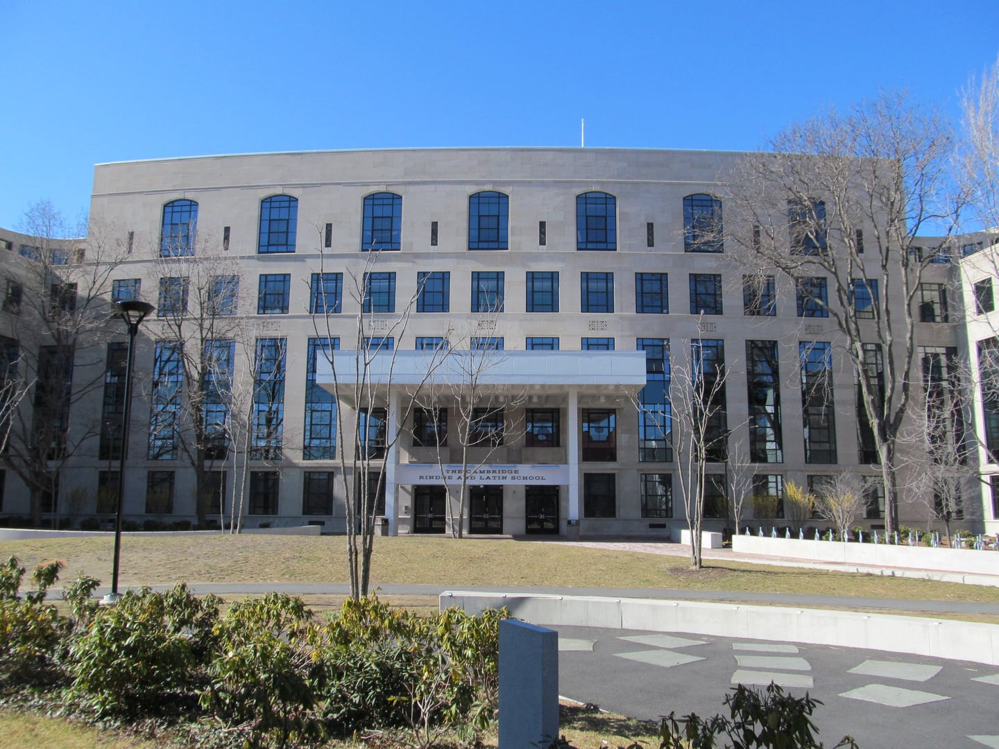 The brick exterior of the Cambridge Rindge and Latin School public high school in Cambridge, Massachusetts, with its iconic war memorial entrance.