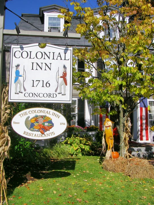The wooden sign reading 'Colonial Inn 1716 Concord' and 'The Colonial Inn Restaurants' in the inn's front yard, autumn 2009.