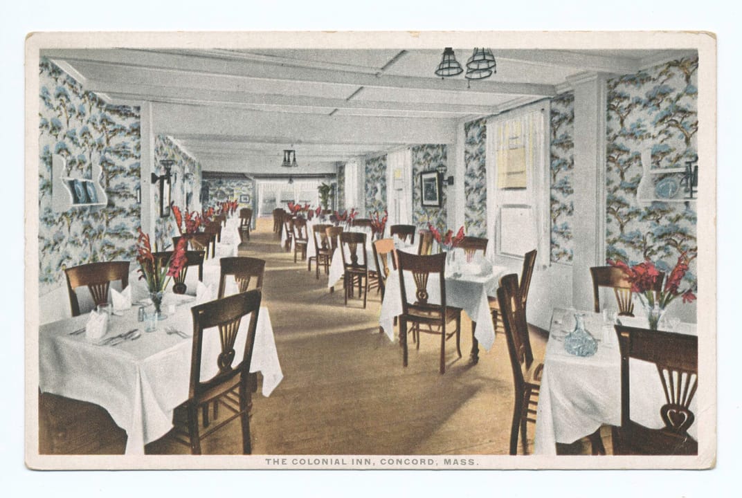 Vintage postcard of the dining room at The Colonial Inn, Concord, Massachusetts, set with linens, from the New York Public Library's postcard collection.