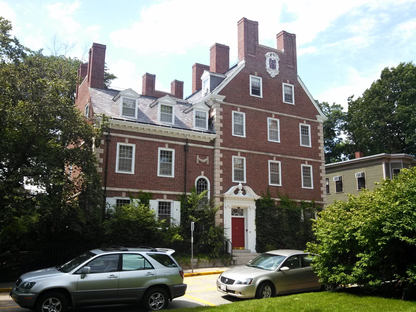 Exterior of Hicks House, a 1762 yellow clapboard pre-Revolutionary home now serving as the Kirkland House library at Harvard in Cambridge, Massachusetts