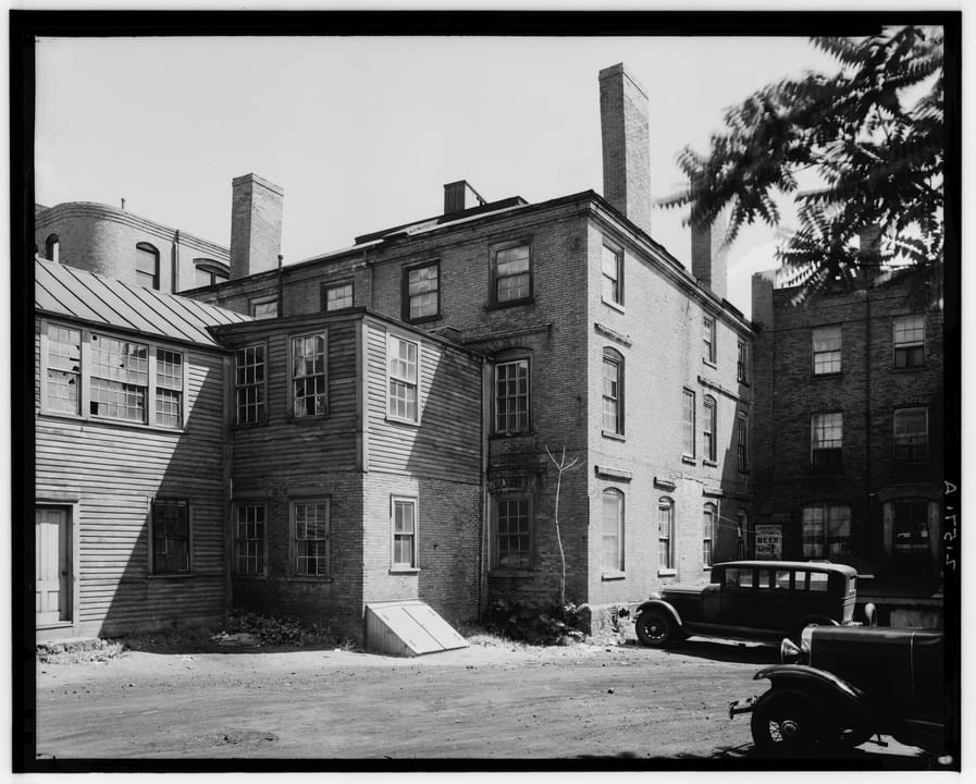 The rear and side elevation of the Joshua Ward House, 148 Washington Street, Salem, Massachusetts, photographed from the southwest for the Historic American Buildings Survey, August 1937.