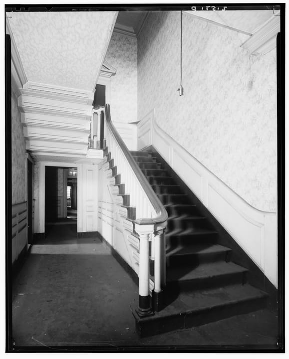 The front hallway and staircase of the Joshua Ward House, Salem, Massachusetts -- the oldest surviving staircase attributed to Salem woodcarver Samuel McIntire -- photographed for the Historic American Buildings Survey, August 1937.
