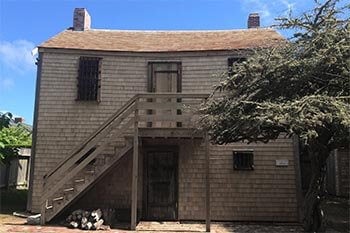Exterior of the Nantucket Old Gaol, an 1805 timber-and-iron jail on Vestal Street, Nantucket, Massachusetts