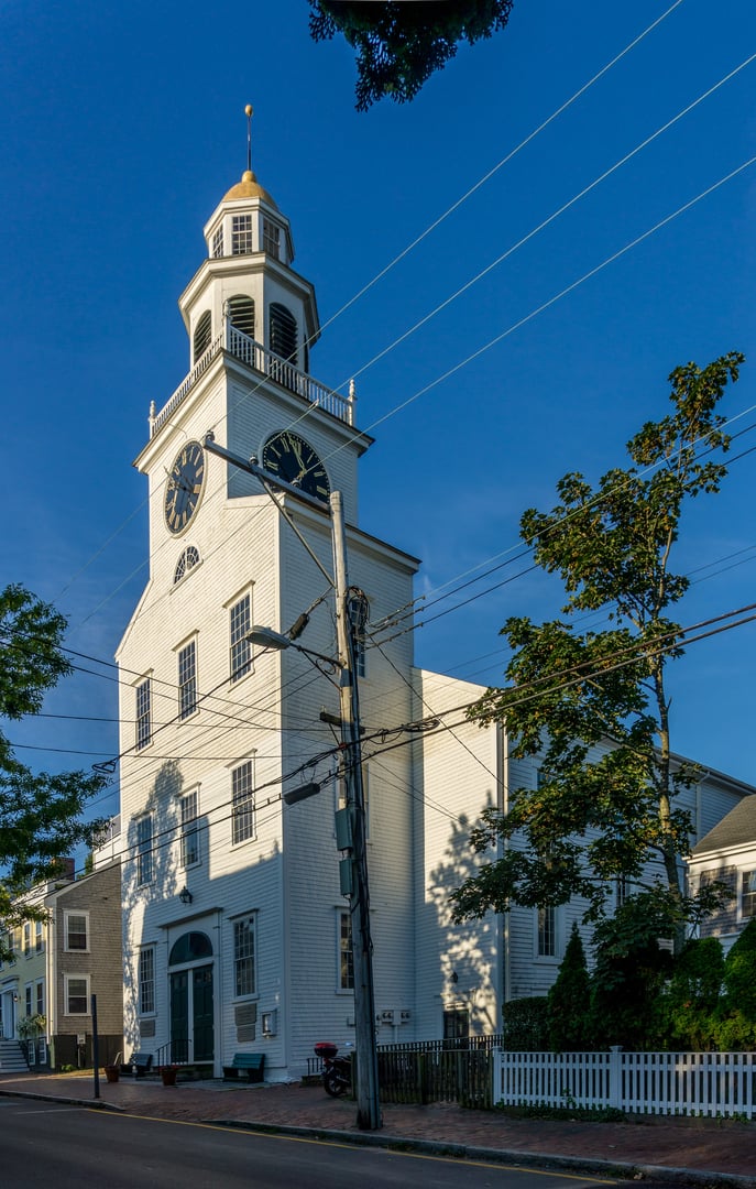 The white clapboard Second Congregational Meeting House with gold-domed clock tower on Orange Street in Nantucket, Massachusetts, built in 1809