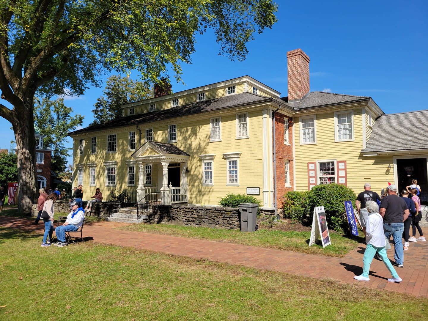 The village green at Storrowton Village Museum in West Springfield, Massachusetts, surrounded by 18th- and 19th-century New England buildings