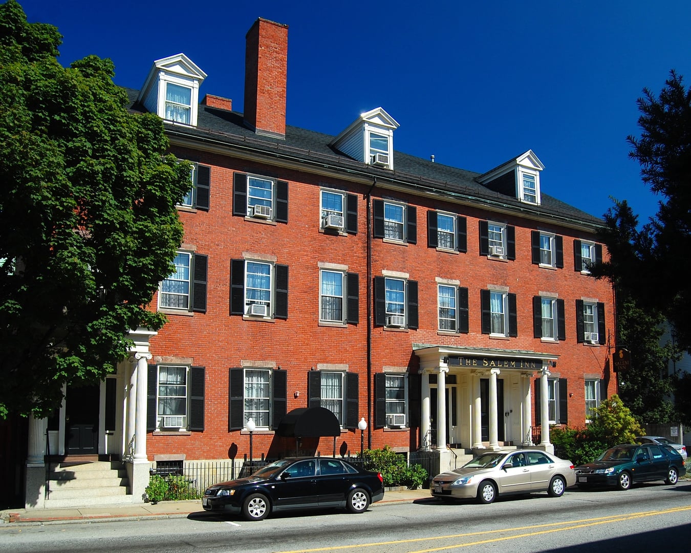 Three-story Federal brick facade of The Salem Inn's West House on Summer Street in Salem, Massachusetts