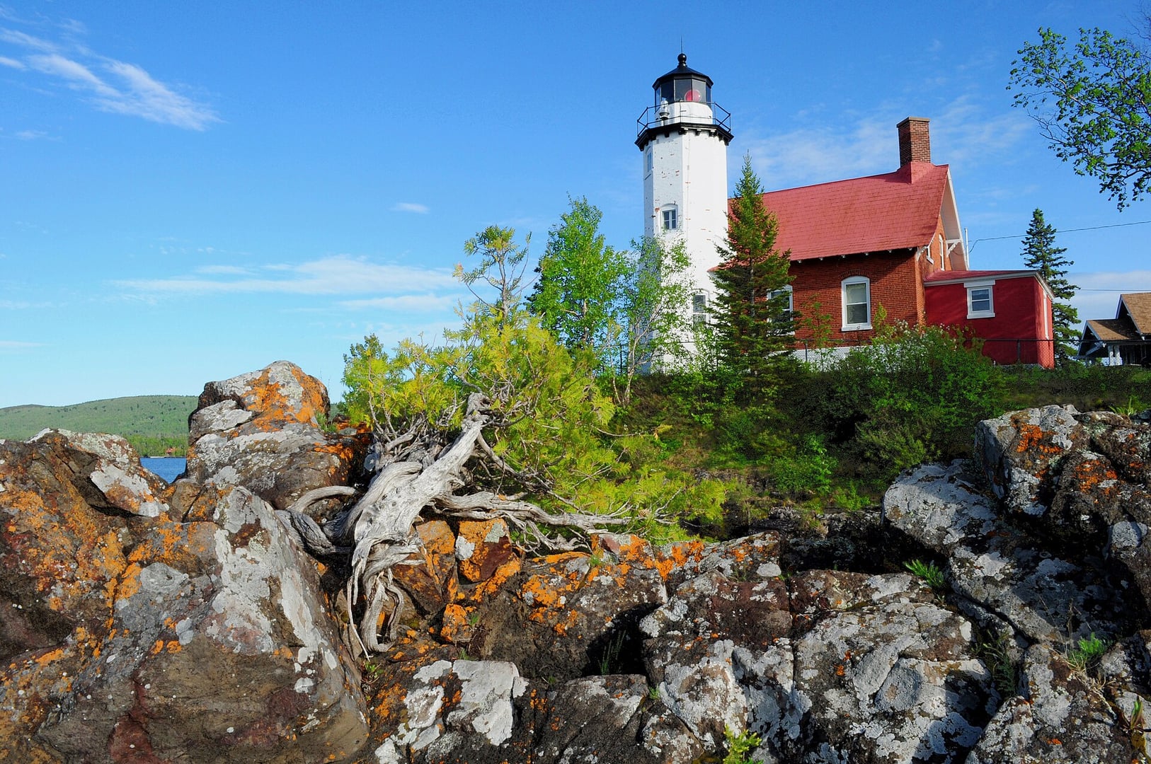 Eagle Harbor Lighthouse octagonal red brick tower at the Lake Superior shoreline in Eagle Harbor, Michigan