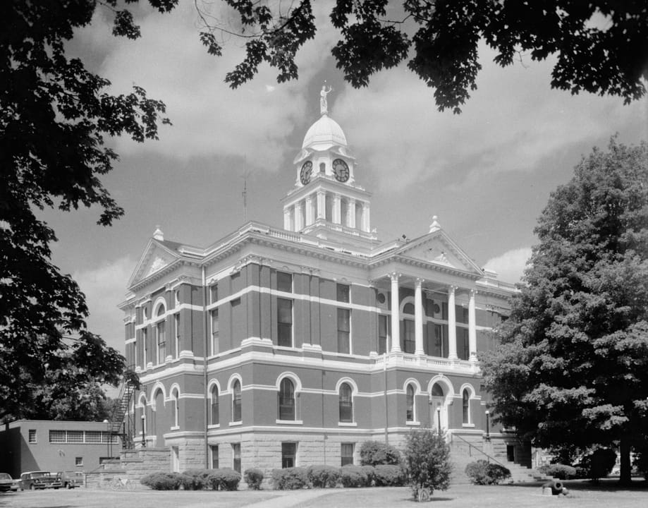 Southern and western sides of the Eaton County Courthouse, located along W. Lawrence Avenue in Charlotte, Michigan, United States.  Built in 1883, it is listed on the National Register of Historic Places.