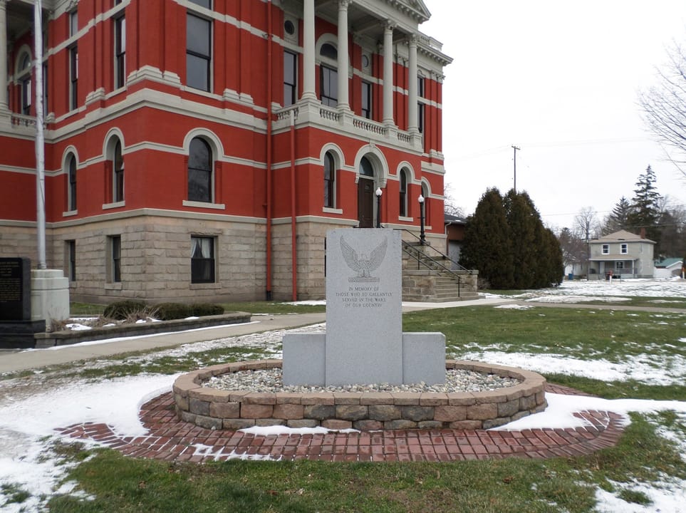 A veterans memorial on the grounds of the former Eaton County Courthouse, now a museum, located at 100 W Lawrence Ave, Charlotte, MI. The building is listed on the National Register of Historic Places.