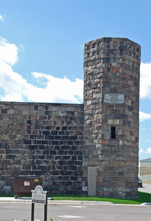 A round stone guard tower along the old prison wall, Michigan's First State Prison site, Jackson.