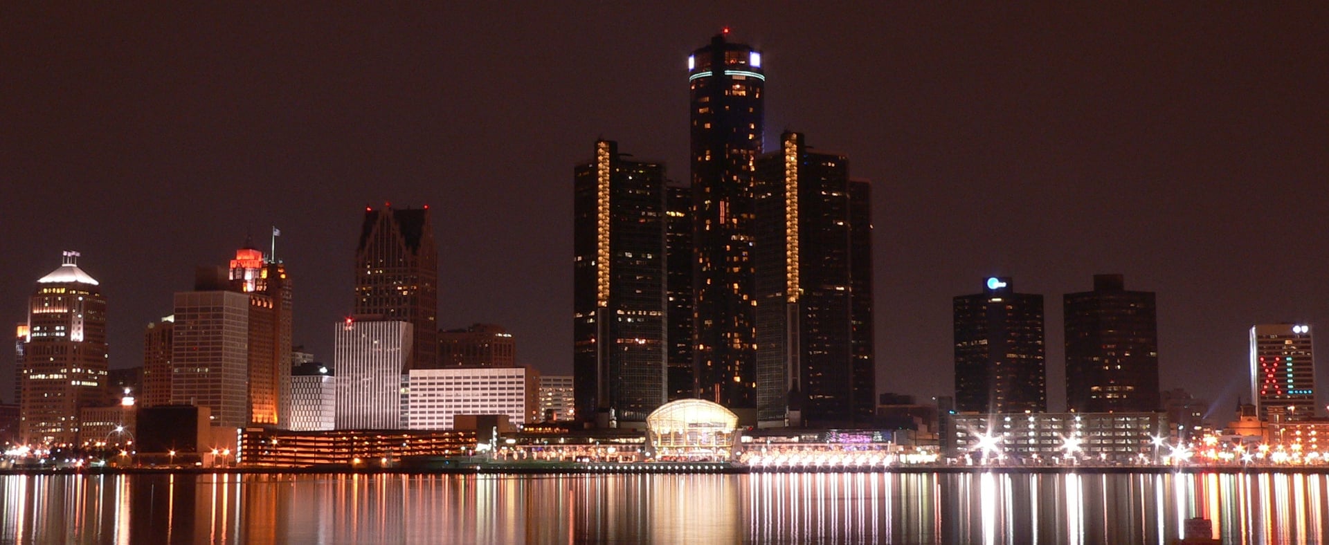 Downtown Detroit's nighttime skyline along the Detroit River, the Motor City backdrop for the Cass Corridor walking ghost tour