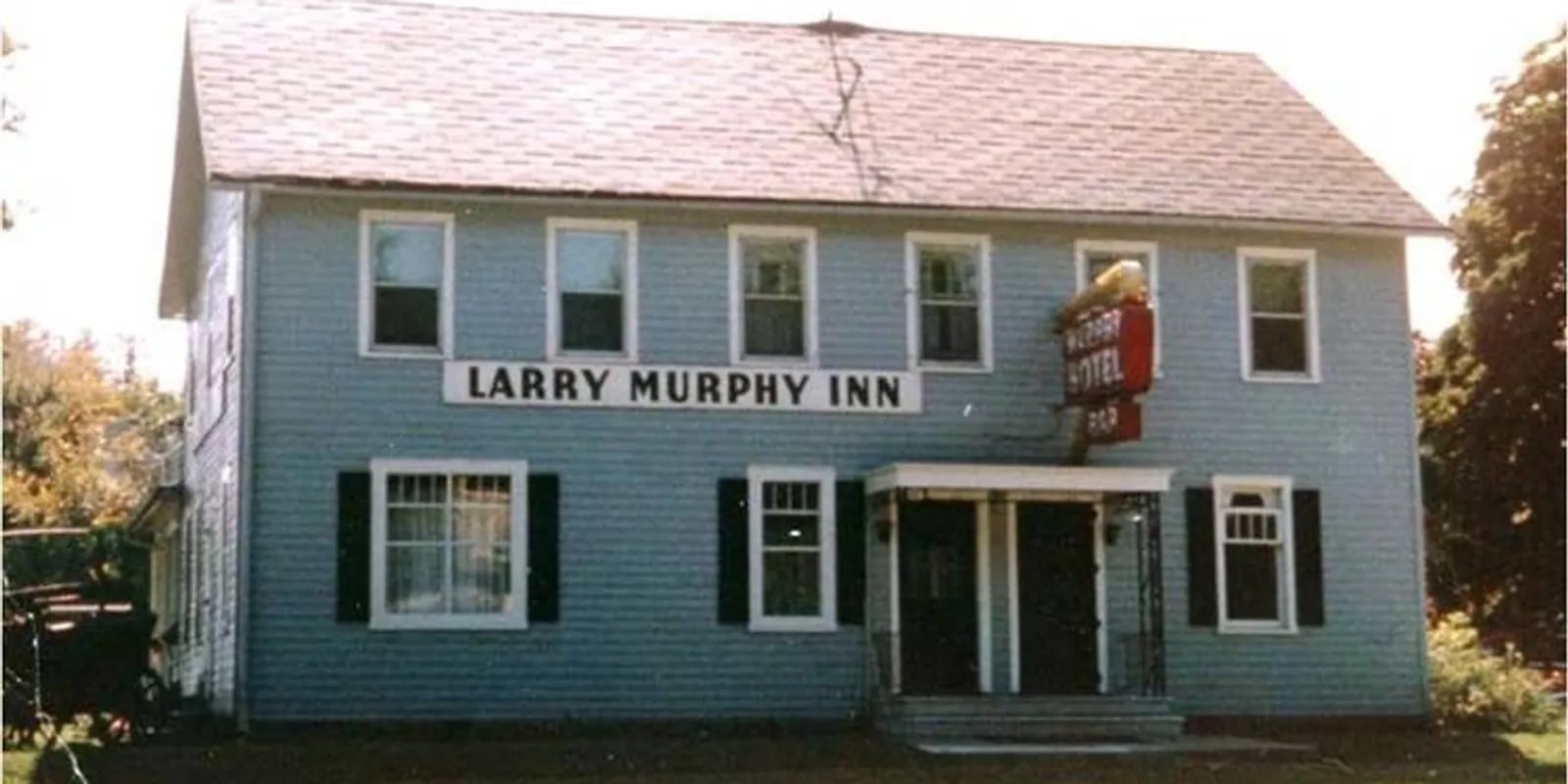 Exterior view of the historic 1836 Murphy Inn on Clinton Avenue in St. Clair, Michigan, a two-story blue-sided former boarding house and one of the state's oldest operating inns