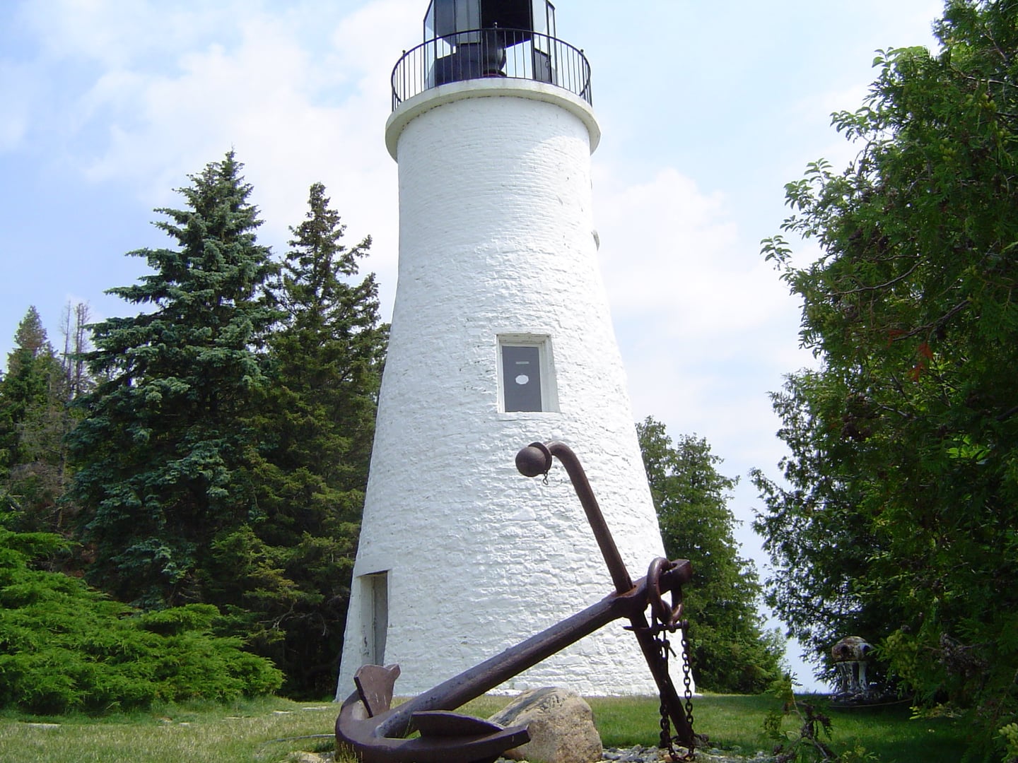 The 1840 stone tower of the Old Presque Isle Light on the shore of Lake Huron in Michigan