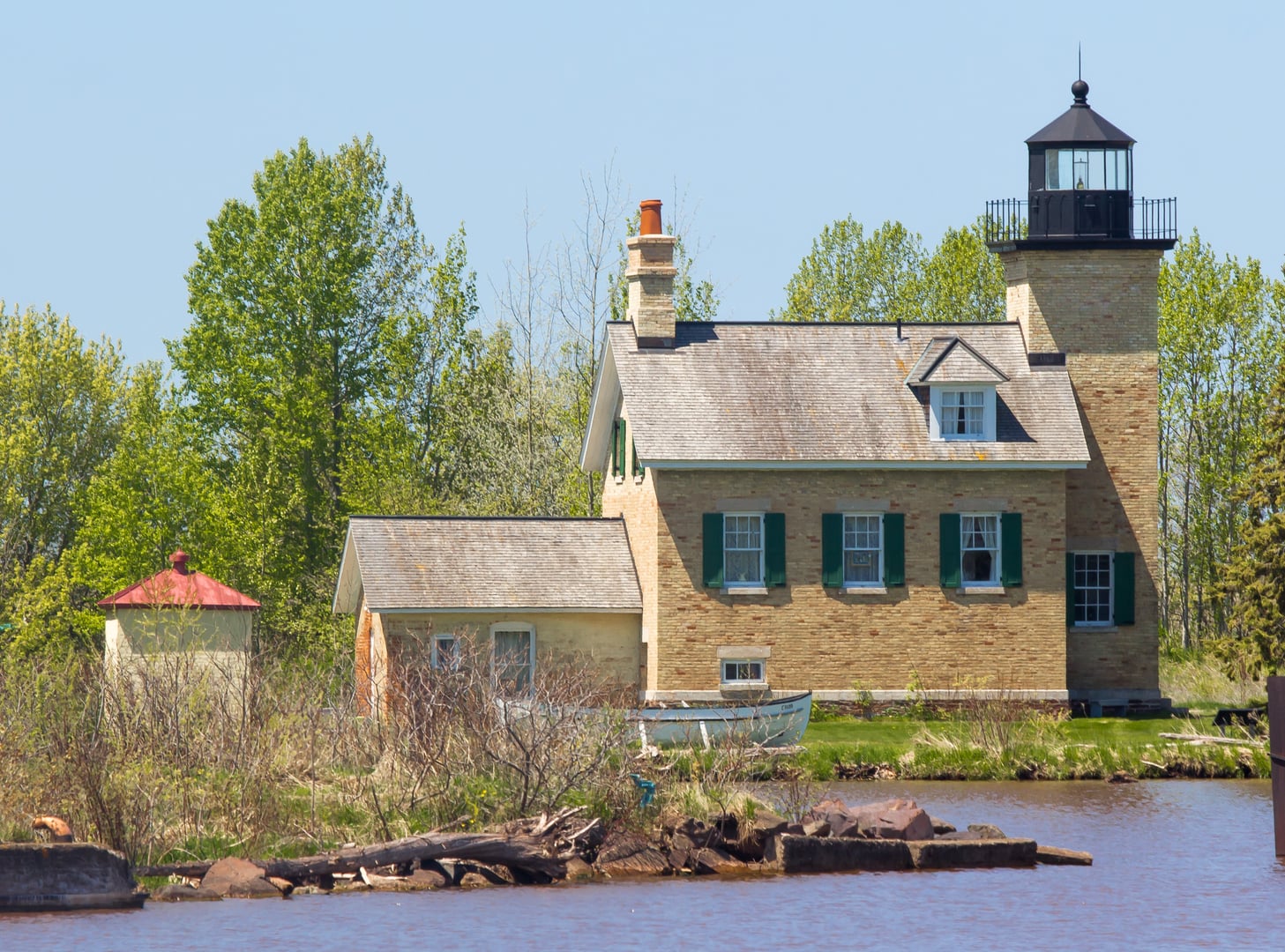 Ontonagon Lighthouse on the western shore of the Ontonagon River, Michigan — 1866 cream-brick keeper's house with attached tower