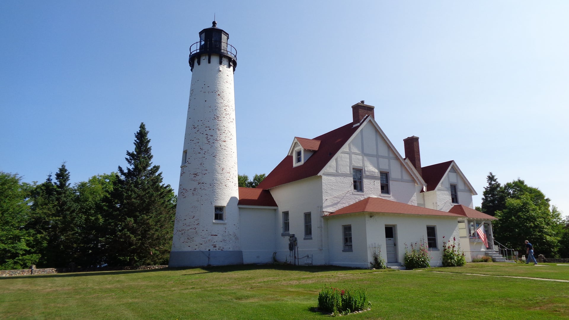 The 1871 white brick Point Iroquois Lighthouse on Lake Superior in Brimley, Michigan