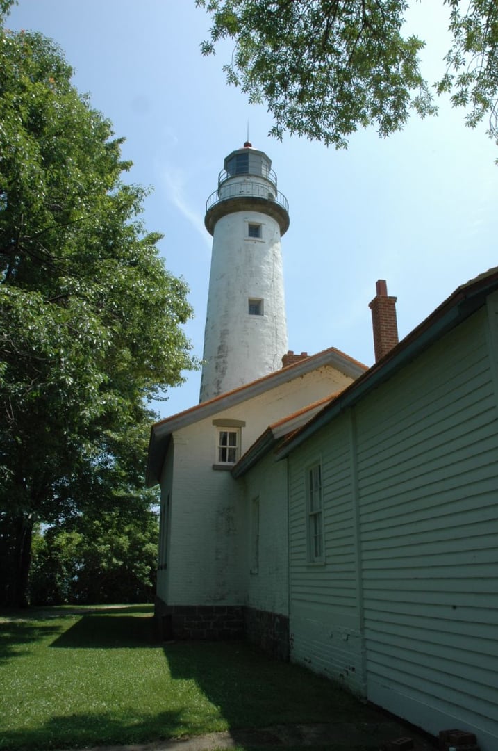 Pointe aux Barques Lighthouse tower and keeper's dwelling on the Lake Huron shoreline in the Michigan Thumb