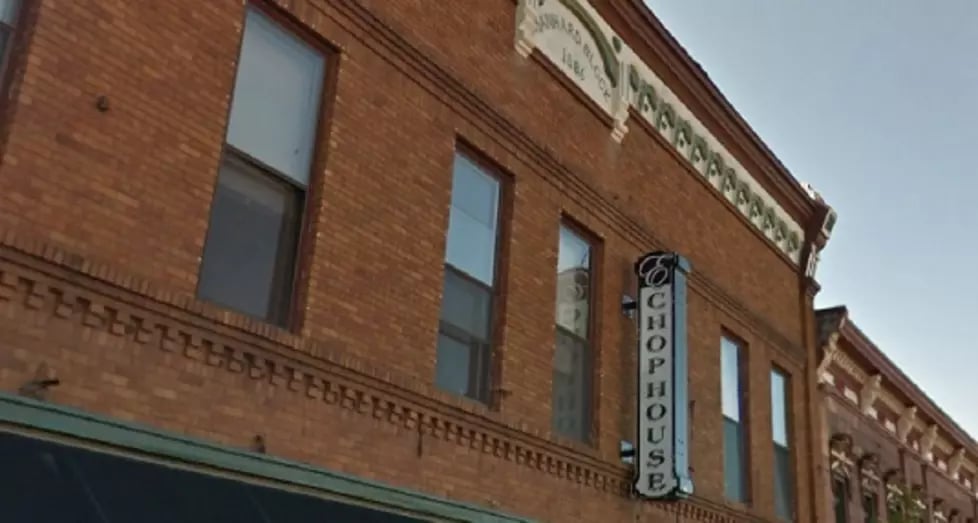 Exterior of the 1886 brick commercial building at 113 South Front Street in Marquette, Michigan — former H. R. Oates Furniture and Undertaking and later the Shamrock Bar.