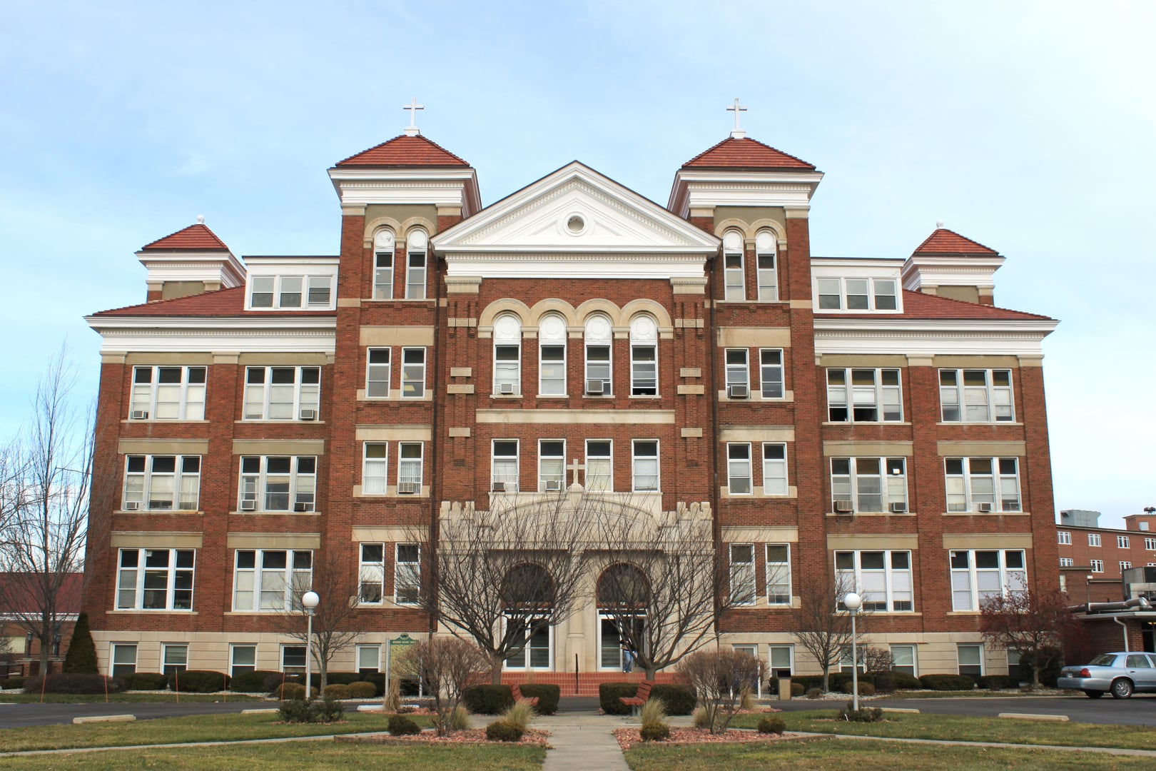 Romanesque Revival brick exterior of Sacred Heart Hall, a Michigan State Historic Site at Siena Heights University in Adrian, Michigan, constructed in 1922.