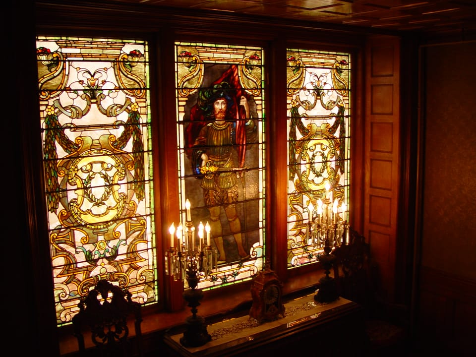 The Tiffany stained-glass window above the grand staircase inside the David Whitney House.