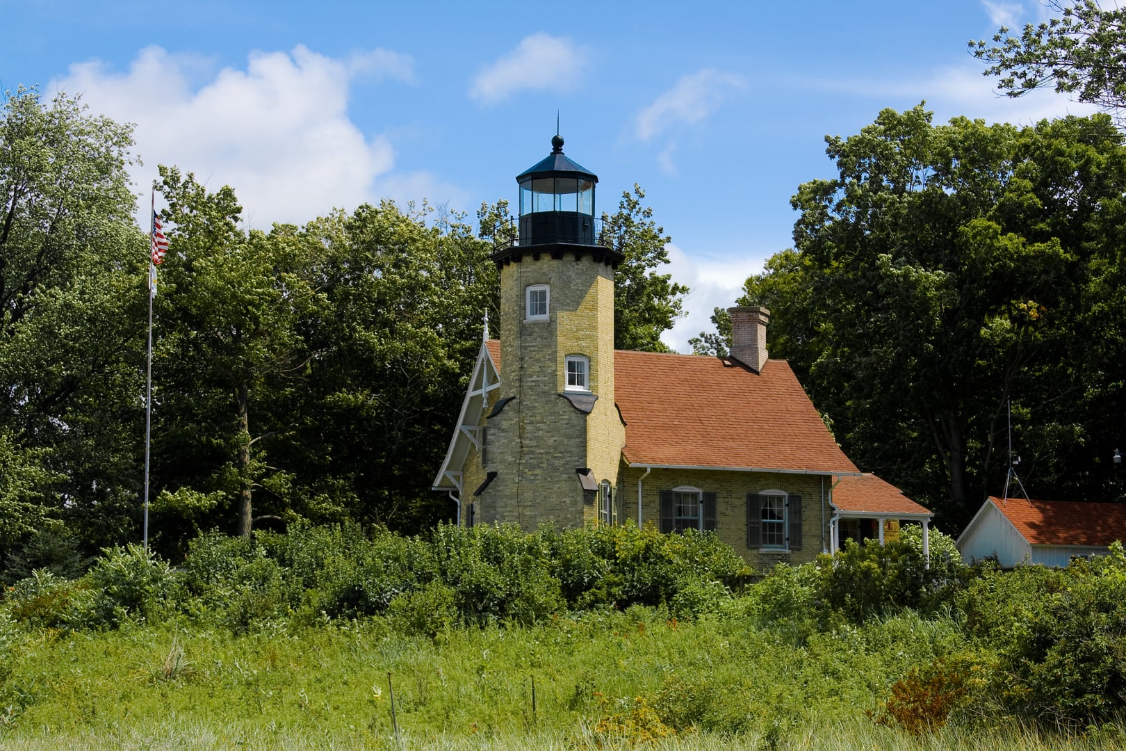 Yellow brick White River Light Station tower and keeper's house near Whitehall Michigan