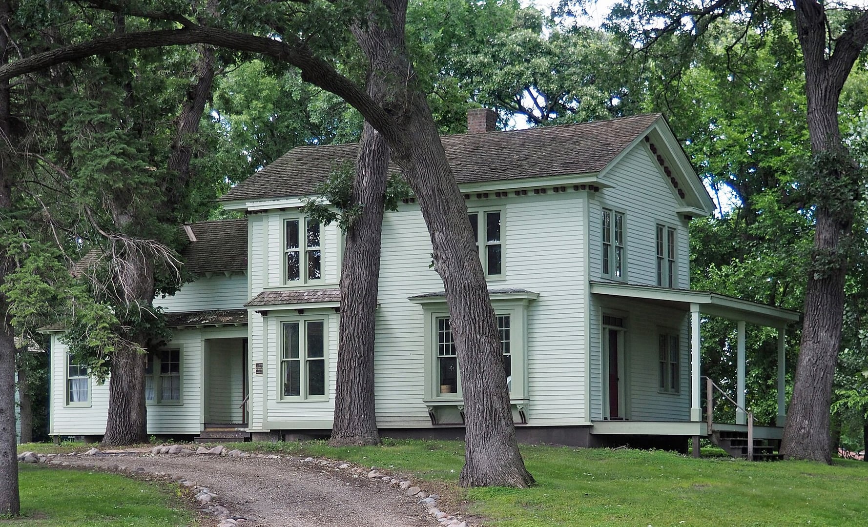 Exterior of the Harrington-Merrill House at 225 Washington Street West, Hutchinson, Minnesota — the only building to survive the September 4, 1862 Dakota attack on the town, viewed from the southeast