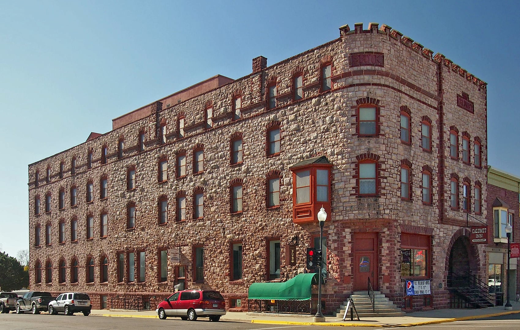 Exterior of the Historic Calumet Inn in Pipestone, Minnesota, showing pink Sioux quartzite facade