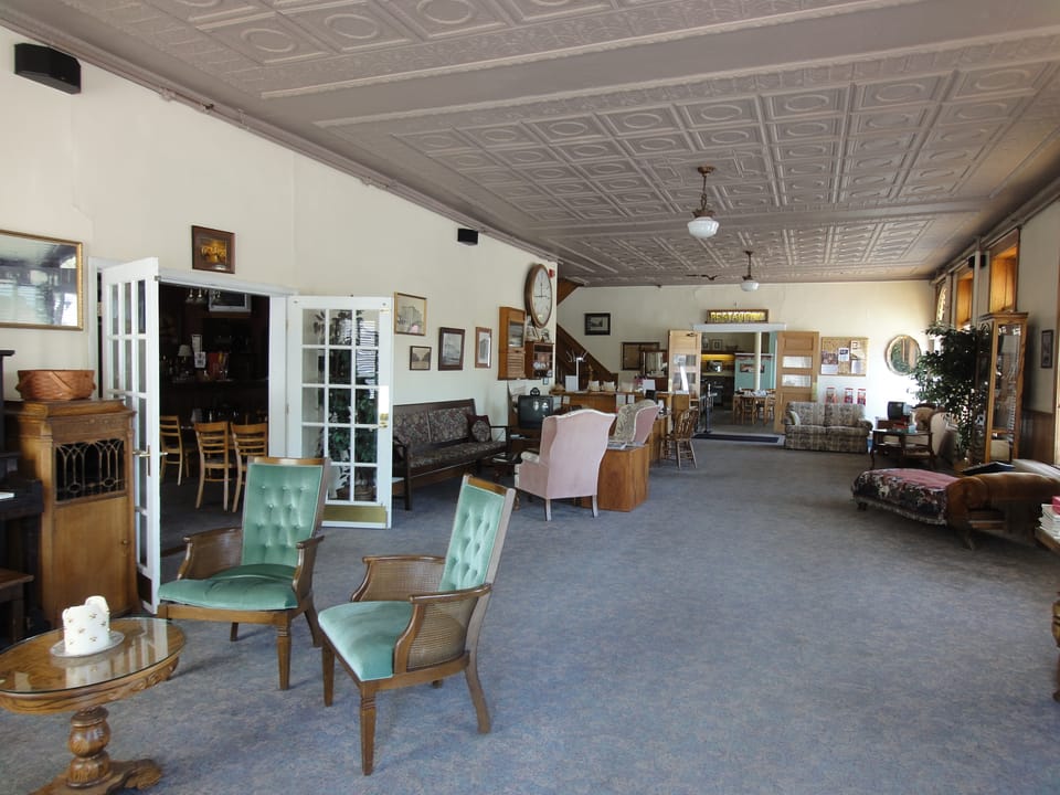 Lobby of the Palmer House Hotel in Sauk Centre, Minnesota, 2012, with its pressed-tin ceiling and period seating.