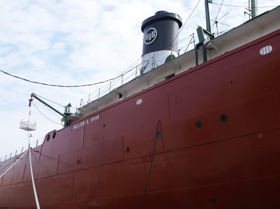Side view of the SS William A. Irvin's hull with the name lettering and the stack bearing the U.S. Steel 'USS' emblem, Duluth, August 2013, before the ship's later restoration.