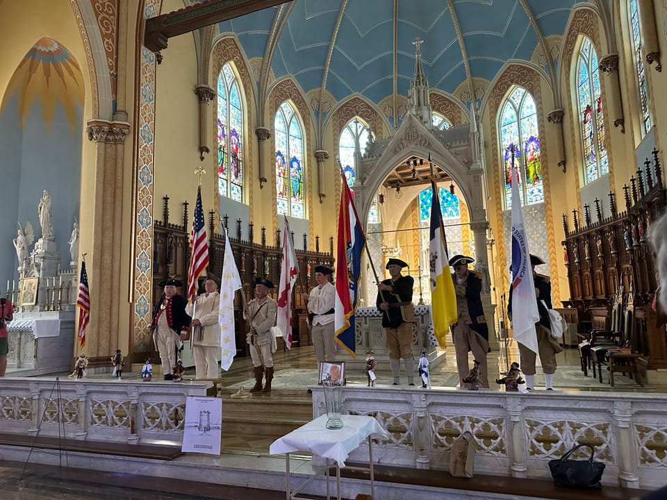 Ste Genevieve Catholic Church ceremony honoring Revolutionary War Patriots buried nearby.
