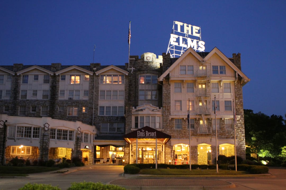 Tudor Revival limestone exterior of the historic Elms Hotel in Excelsior Springs, Missouri