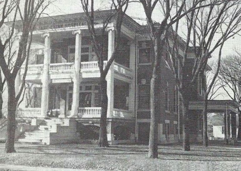 Historic 1910 postcard photograph of the Jane Chinn Hospital building in Webb City, Missouri, designed by architect F.W. Caulkins.
