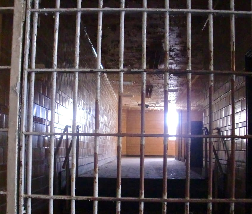 A barred cellblock corridor inside the Missouri State Penitentiary museum, Jefferson City, Missouri, 2013.