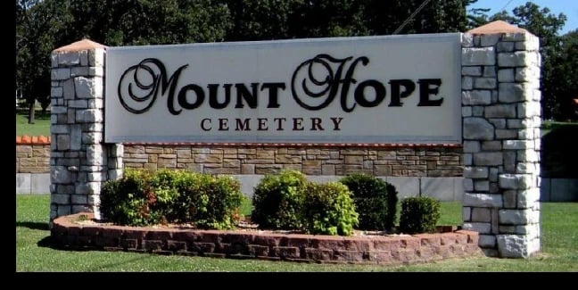 Mt. Hope Cemetery in Webb City, Missouri, with the large central angel statue on an elevated section of the grounds