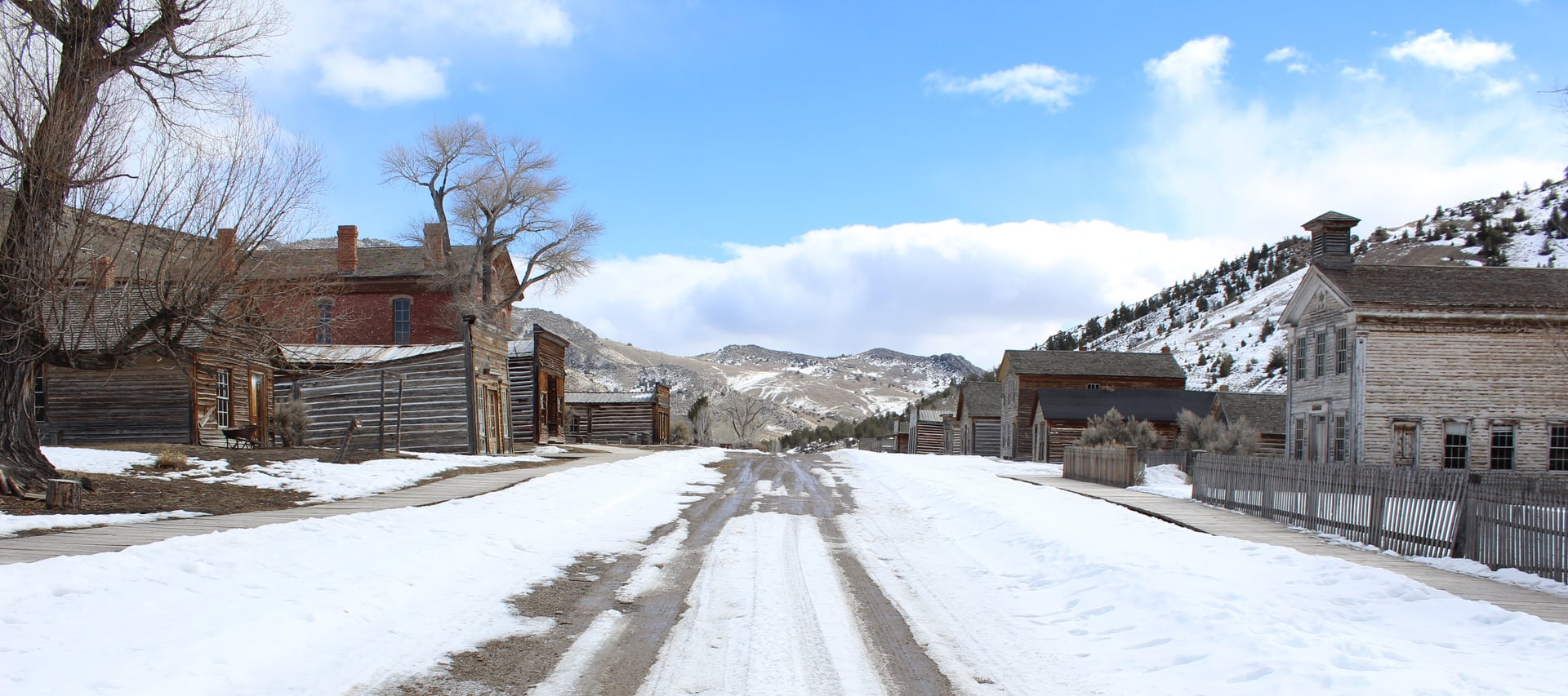 Historic wooden buildings line the main street of Bannack ghost town and state park in Montana