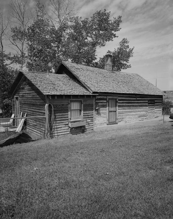 Rear and east side of the Thomas Francis Meagher House on Idaho Street -- a plain log/frame house with a single chimney -- Meagher was acting governor of Montana Territory in the 1860s.