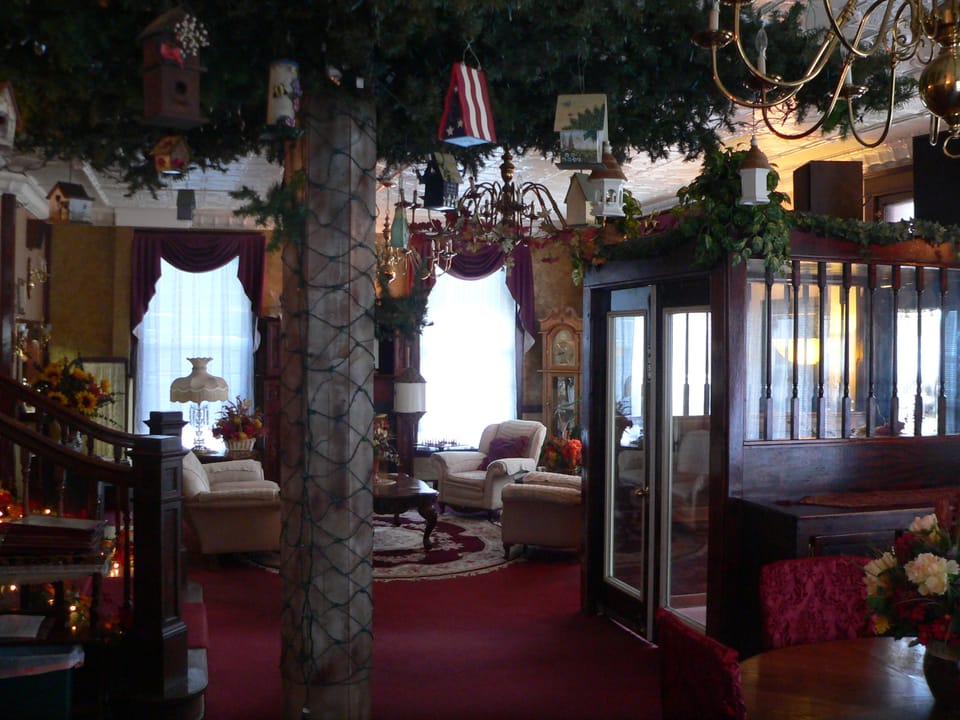Sitting area in the lobby of the Historic Argo Hotel, Crofton, Nebraska, with a bay window and period furnishings.