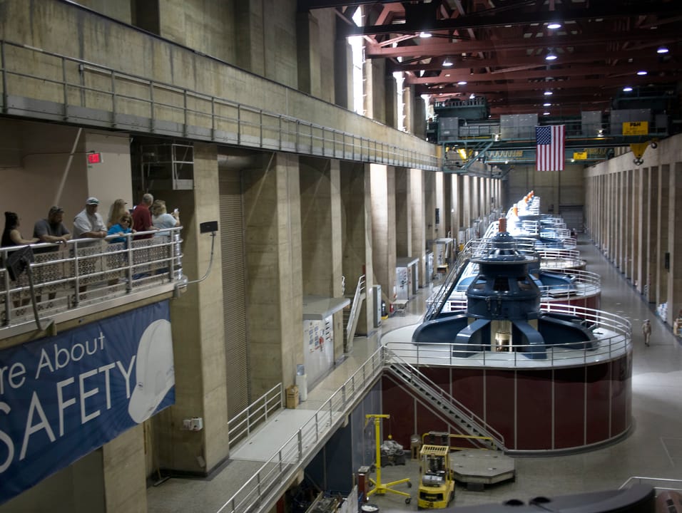 The generator hall in the Nevada wing powerplant at Hoover Dam, viewed on a public tour.