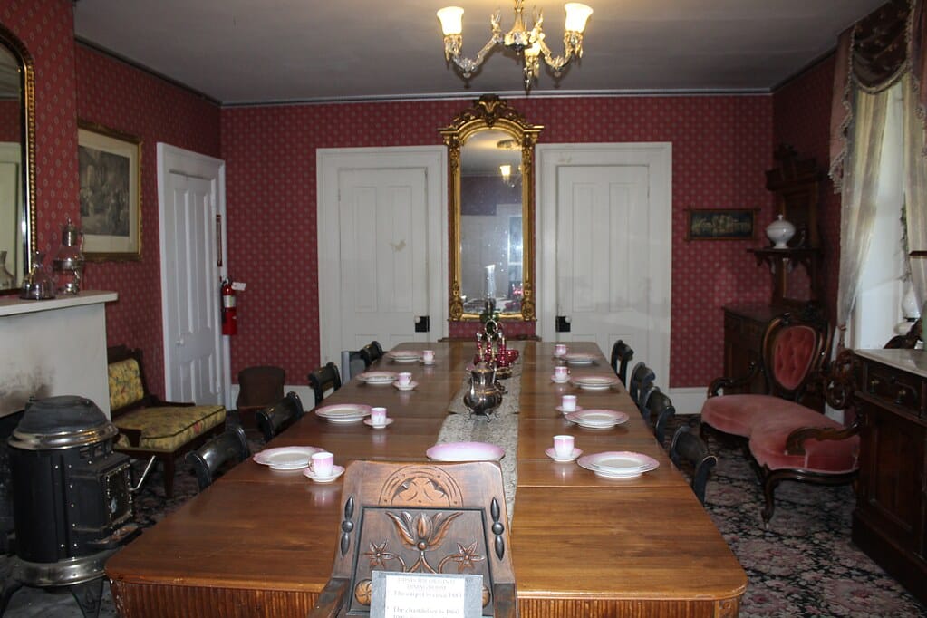The furnished dining room inside the Mackay Mansion house museum, part of the venue's public walk-through tour.